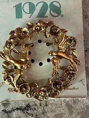 1928 bird and floral brooch